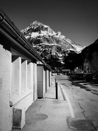 Street amidst buildings against sky