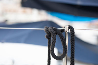 Close-up of rope tied on metal