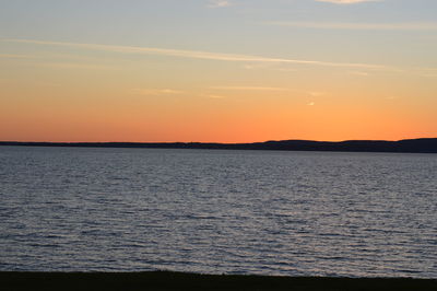 Scenic view of sea against sky at sunset