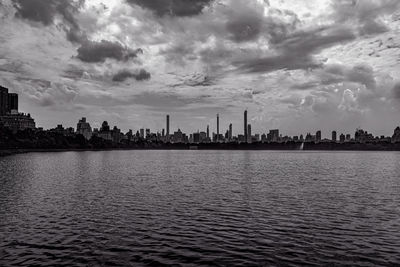 Panoramic view of sea and buildings against sky