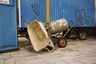 Wheelbarrow and push cart on walkway