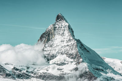 Scenic view of snowcapped mountain against sky