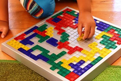 High angle view of child playing on table