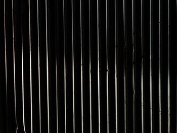 Full frame shot of metal grate against wall