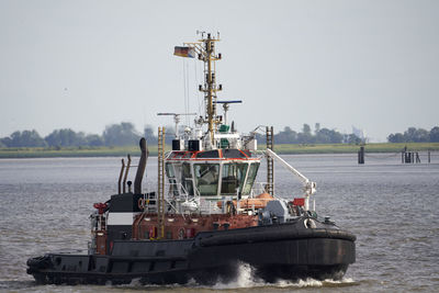 Ship in sea against clear sky