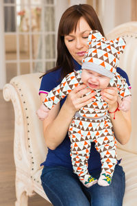 Woman with baby girl with hands