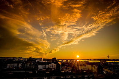 Aerial view of townscape against sky during sunset