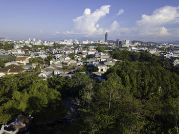 High angle view of buildings in city against sky