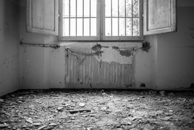 Damaged window in abandoned house