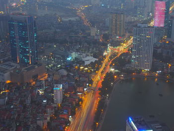 High angle view of illuminated city buildings at night