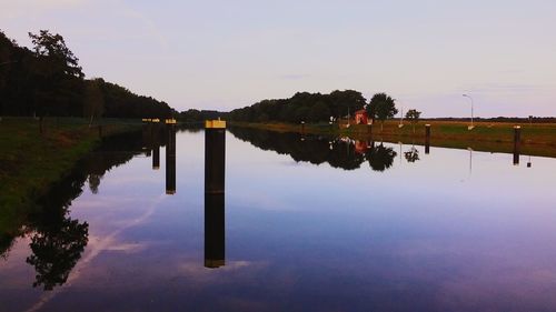 Scenic view of calm lake against clear sky