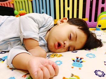 Portrait of cute baby lying on sofa