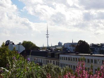 View of residential district against cloudy sky