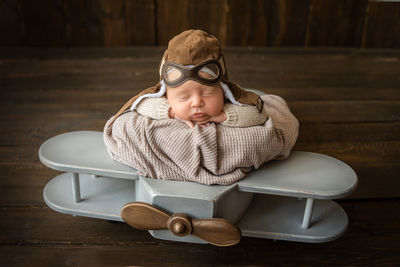 High angle view of woman wearing sunglasses on table