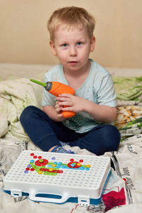 Cute boy sitting at home