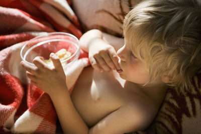 Boy eating snacks, sweden