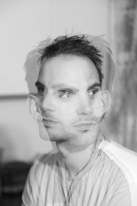 Close-up portrait of young man at home