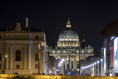 The long avenue of the vatican with st. peter's basilica in the background at night