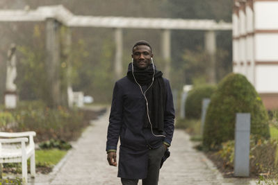 Portrait of smiling man standing outdoors