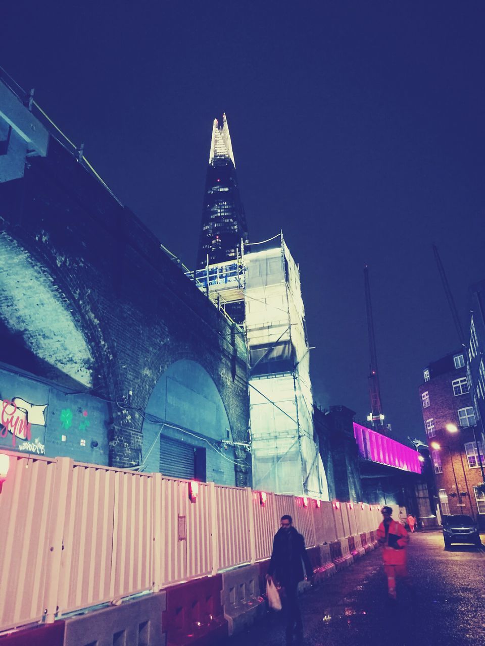 architecture, built structure, building exterior, outdoors, sky, travel destinations, city, low angle view, night, real people, skyscraper, clock tower