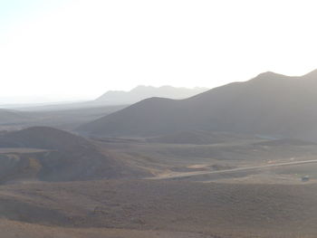 Scenic view of desert against clear sky