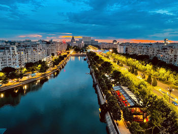 High angle view of river amidst buildings in city