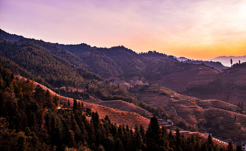 Scenic view of mountains against sky during sunset