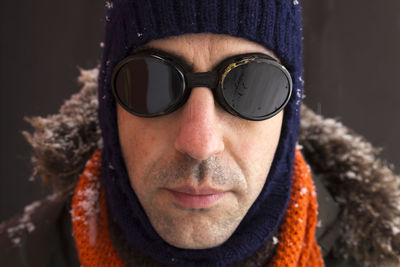 Close-up portrait of man wearing sunglasses