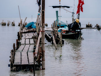 Fishing boats moored at harbor