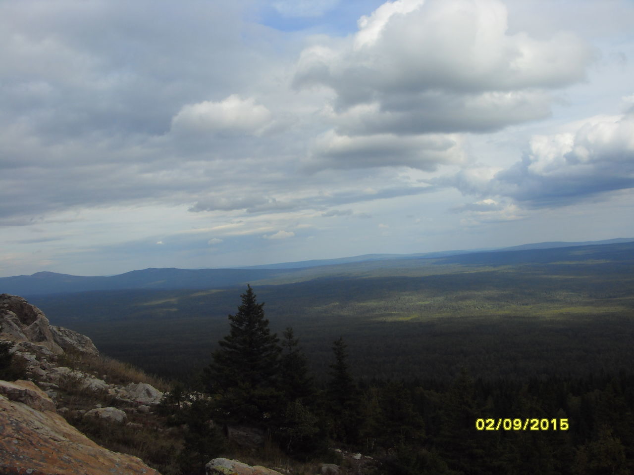 SCENIC VIEW OF MOUNTAINS AGAINST CLOUDY SKY