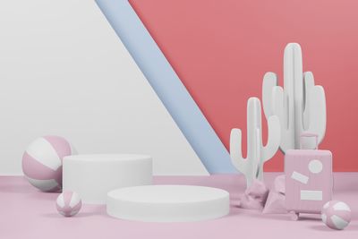 Close-up of colored pencils on table against wall