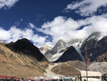 Scenic view of snowcapped mountains against sky