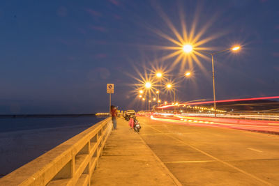 Light trails on beach at night