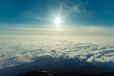 Sun shining through clouds