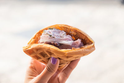 Close-up of hand holding ice cream