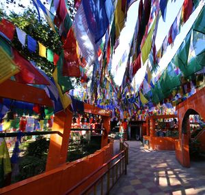 Clothes hanging in row at temple