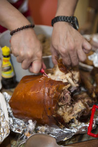 Close-up of man preparing food