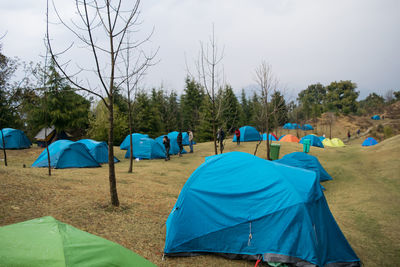 Panoramic view of tent on field against sky