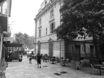 People walking in front of building