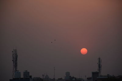 Silhouette of buildings at sunset