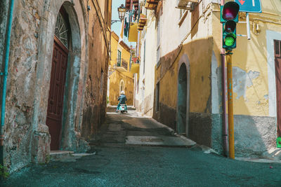 Alley amidst old buildings in city