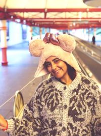 Portrait of smiling woman in warm clothing during winter