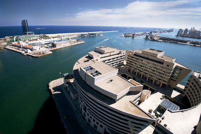 High angle view of harbor by sea against sky