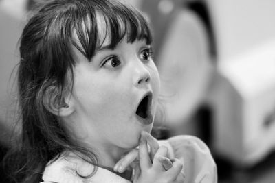 Close-up of girl with mouth open