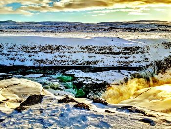 Scenic view of sea against sky during winter