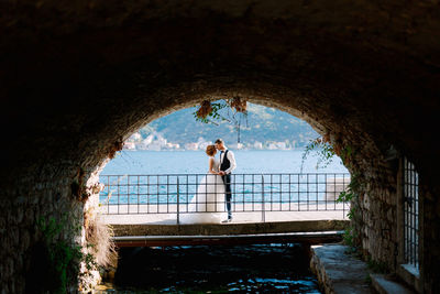 Couple standing at archway