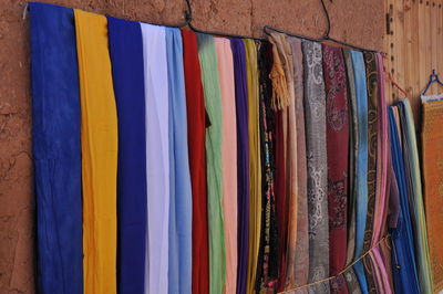Multi colored umbrellas hanging at market stall