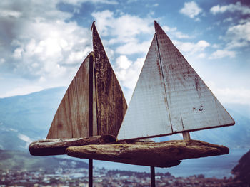 Artwork of wooden ships with blurry landscape in the background