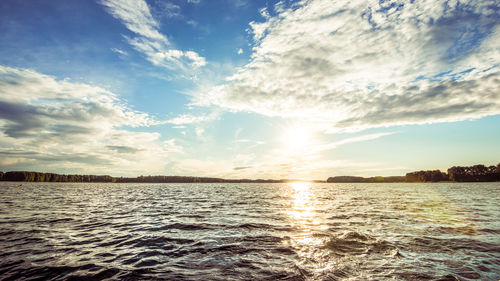 Scenic view of sea against sky at sunset