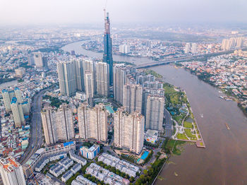 High angle view of modern buildings in city against sky